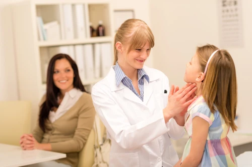 Pediatrician examine child throat cold prevention